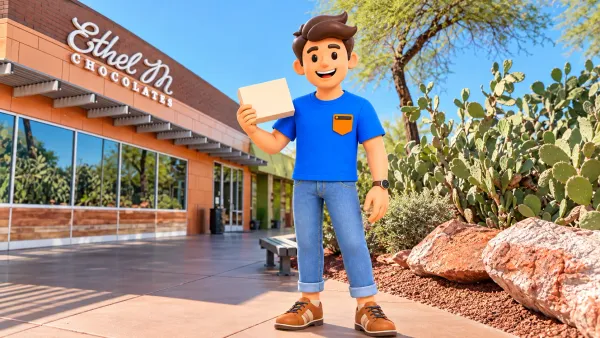 Voyageur avec une boîte de chocolats devant Ethel M à Henderson